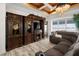 Living room with hardwood floors, sectional sofa, and lake view at 27 Meadowlark Ln, Placida, FL 33946