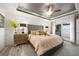 Main bedroom with plush bed and access to balcony at 27 Meadowlark Ln, Placida, FL 33946