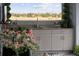 Outdoor kitchen with granite countertop and lake view at 27 Meadowlark Ln, Placida, FL 33946