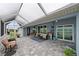 Large screened patio with seating and lake view at 27 Meadowlark Ln, Placida, FL 33946