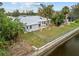 Aerial view of house with backyard and canal access at 28434 Sabal Palm Dr, Punta Gorda, FL 33982