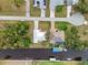 Aerial view showing house, pool, dock, and canal at 28434 Sabal Palm Dr, Punta Gorda, FL 33982