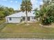 Backyard with lush landscaping and canal view at 28434 Sabal Palm Dr, Punta Gorda, FL 33982