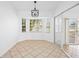 Bright breakfast nook with tile floor and view to backyard at 28434 Sabal Palm Dr, Punta Gorda, FL 33982
