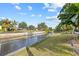 Waterfront property with a canal view and grassy backyard at 28434 Sabal Palm Dr, Punta Gorda, FL 33982