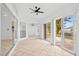 Sunroom featuring tile floors, sliding glass doors, and backyard access at 28434 Sabal Palm Dr, Punta Gorda, FL 33982