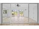 Bright sunroom with tile floors and sliding glass doors at 28434 Sabal Palm Dr, Punta Gorda, FL 33982