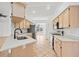 Kitchen with stainless steel appliances and light wood cabinets at 28434 Sabal Palm Dr, Punta Gorda, FL 33982