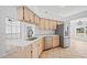 Kitchen with light wood cabinets and quartz counters at 28434 Sabal Palm Dr, Punta Gorda, FL 33982