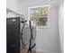 Laundry room with washer, dryer, and window at 28434 Sabal Palm Dr, Punta Gorda, FL 33982