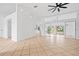 Bright living room with tile floors and sliding glass doors at 28434 Sabal Palm Dr, Punta Gorda, FL 33982