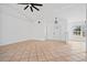 Spacious living room with tile floors and access to the front entry at 28434 Sabal Palm Dr, Punta Gorda, FL 33982