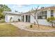 Ground level patio with stonework and landscaping at 28434 Sabal Palm Dr, Punta Gorda, FL 33982