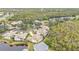 Property location view showcasing surrounding houses and water at 3112 Club Dr # 124, Port Charlotte, FL 33953