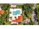 Community pool and spa surrounded by lush landscaping and residential buildings at 3112 Club Dr # 124, Port Charlotte, FL 33953