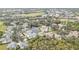 Aerial view of community, showcasing numerous homes and landscape at 3112 Club Dr # 124, Port Charlotte, FL 33953