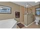 Bathroom with a large walk-in shower and a corner soaking tub at 3112 Club Dr # 124, Port Charlotte, FL 33953