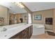 Double vanity bathroom with a corner soaking tub at 3112 Club Dr # 124, Port Charlotte, FL 33953