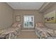 Charming bedroom with twin beds, window seating, and ample natural light at 3112 Club Dr # 124, Port Charlotte, FL 33953
