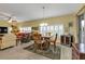 Bright dining area with wood table and wine cooler at 3112 Club Dr # 124, Port Charlotte, FL 33953
