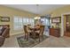 Casual dining area with table and chairs near sliding doors at 3112 Club Dr # 124, Port Charlotte, FL 33953