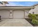 Two-car garage with automatic door opener and ample parking space at 3112 Club Dr # 124, Port Charlotte, FL 33953