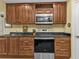 Modern kitchen with stainless steel appliances and granite countertops at 3112 Club Dr # 124, Port Charlotte, FL 33953