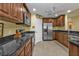 Well-equipped kitchen with stainless steel appliances and granite countertops at 3112 Club Dr # 124, Port Charlotte, FL 33953