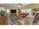 Spacious living room featuring comfortable seating and large TV at 3112 Club Dr # 124, Port Charlotte, FL 33953