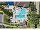 Community pool with lap lanes, lounging areas, and shade structures at 3112 Club Dr # 124, Port Charlotte, FL 33953