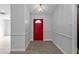 Bright entryway with red door and wood-look floors at 3175 Eagle Pass St, North Port, FL 34286