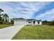 Newly constructed home with attached garage and spacious lawn at 3329 Casco Cir, North Port, FL 34288