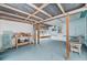 Covered back patio with wooden workbench and seating at 3461 Normandy Dr, Port Charlotte, FL 33952