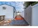 Brick pathway leads to gated backyard access at 3461 Normandy Dr, Port Charlotte, FL 33952