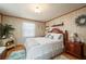 Serene bedroom with a queen bed and wood-paneled walls at 3461 Normandy Dr, Port Charlotte, FL 33952