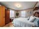 Comfortable bedroom with wood-paneled walls and a queen bed at 3461 Normandy Dr, Port Charlotte, FL 33952