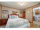 Spacious bedroom with a queen bed and ensuite bathroom at 3461 Normandy Dr, Port Charlotte, FL 33952