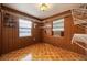 Room with wood paneling, shelving and flooring at 3461 Normandy Dr, Port Charlotte, FL 33952