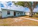 Front view of light blue house with walkway at 3461 Normandy Dr, Port Charlotte, FL 33952