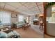 Living room with wood paneling and wicker furniture at 3461 Normandy Dr, Port Charlotte, FL 33952