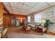Living room with wood paneling, sofas and coffee table at 3461 Normandy Dr, Port Charlotte, FL 33952