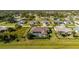 Aerial view of house with pool and screened enclosure at 358 Paramaribo St, Punta Gorda, FL 33983