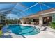 Resort-style pool with screened enclosure and outdoor kitchen at 358 Paramaribo St, Punta Gorda, FL 33983