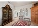 Bright sitting room featuring antique cabinet and gallery wall at 358 Paramaribo St, Punta Gorda, FL 33983