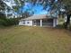 Spacious backyard with a screened patio and lush grass at 3739 Eldron Ave, North Port, FL 34286