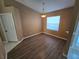 Simple dining room with vinyl plank flooring and neutral walls at 3739 Eldron Ave, North Port, FL 34286