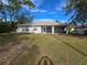 Single story house with covered patio and grassy backyard at 3739 Eldron Ave, North Port, FL 34286