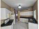 Bright kitchen featuring white cabinets, and modern appliances at 3739 Eldron Ave, North Port, FL 34286