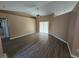 Living room with wood-look flooring and vaulted ceilings at 3739 Eldron Ave, North Port, FL 34286