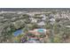 Community pool, tennis courts, and surrounding landscape are visible from above at 428 Rose Apple Cir, Port Charlotte, FL 33954